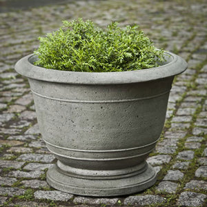 Medium Padova Planter filled with plants in the backyard