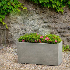 Metro Box Planter filled with pink flowers beside short planter with plants