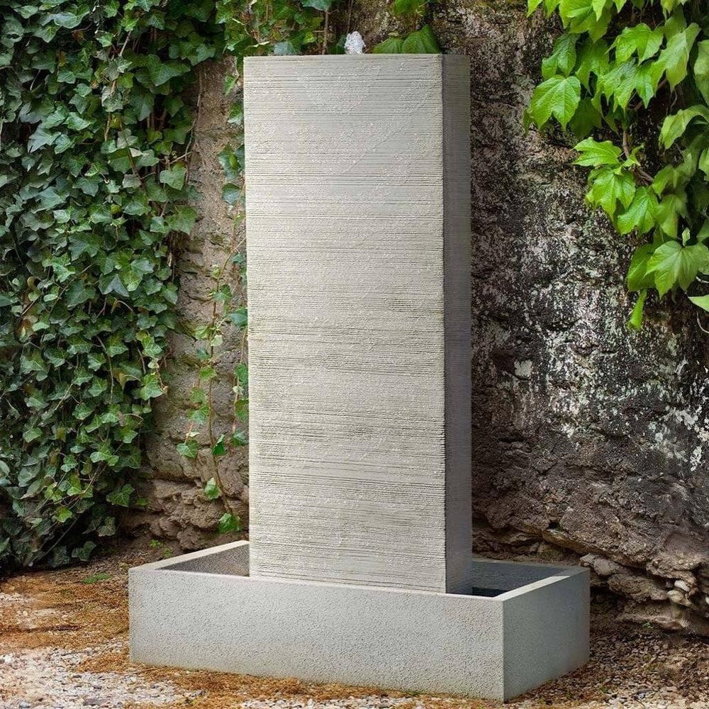 Metropol Fountain on gravel against the rock wall