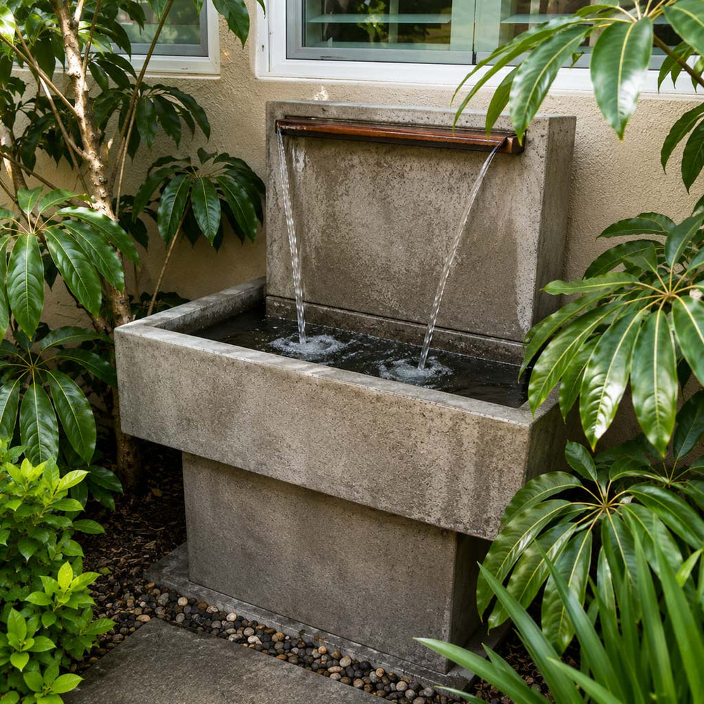 modern fountain surrounded by trees