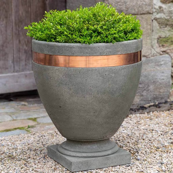 Moderne Planter on gravel filled with plants