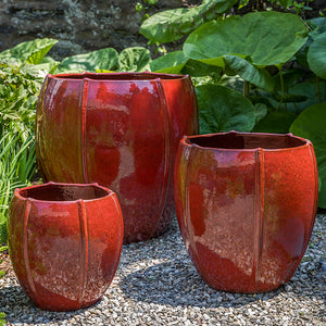Rib Vault Planter - Tropical Red - S/3 on gravel in the backyard