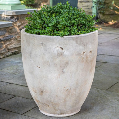 Rovigo Planter - Antico Terra Cotta - S/1 on concrete filled with plants