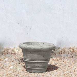 Rustic Rolled Rim 11-5 Planter on gravel in the backyard