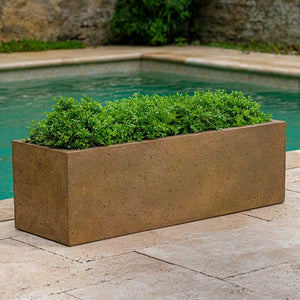 Rustic Trough Planter filled with plants near swimming pool