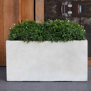 Sandal Planter 361818 - Ivory Lite - S/1 on patio filled with plants
