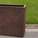 Sandal Planter - 361836 - Rust Lite S/1 on concrete in the backyard