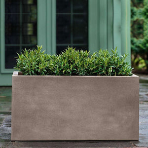 Sandal Planter - 592424 - Riverstone Premium Lite - S/1 on concrete filled with plants