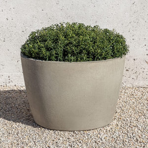 Design Urb Series 2 24 inch by 16 inch planter on gravel filled with plants