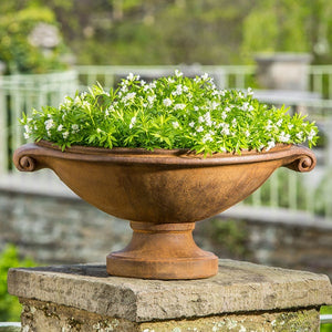 Small Medici Planter filled with white flowers in the backyard