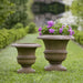 Small Williamsburg Wren Planter filled with purple flowers beside an empty planter