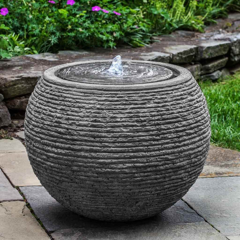 large sonora fountain in black stone ledge in action