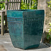 Square Borsa Planter - Indigo Rain - S/3 near a chair in the backyard