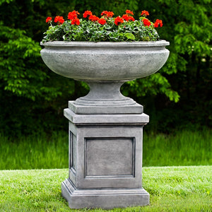 St. Louis Planter on pedestal filled with red flowers