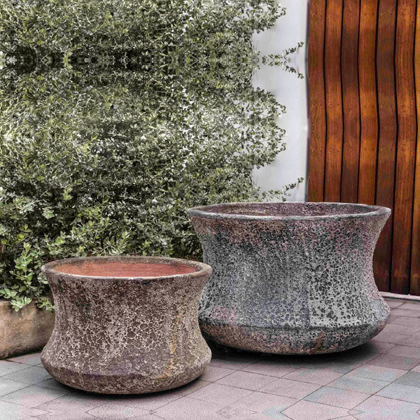 Thira Planter Aegean S/2 on concrete beside green plants