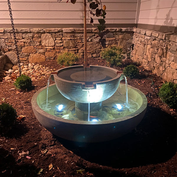 three led lights shining from bowl fountain