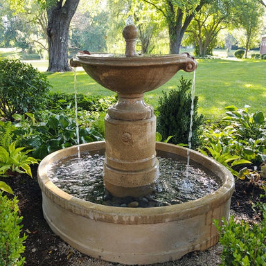 Upclose borghese in basin fountain running in backyard