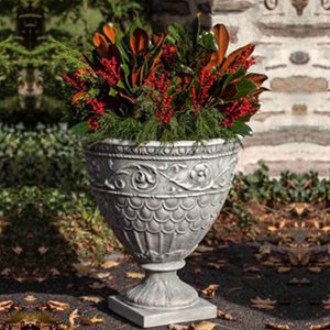 Valadier Urn filled with plants in the backyard